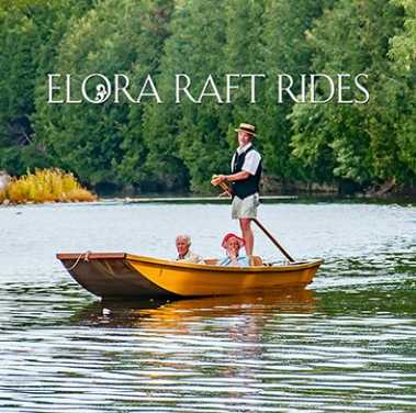 Yellow raft with tourists on a lake, passing a man with a pole. Trees in the background. “Elora Raft Rides” text.