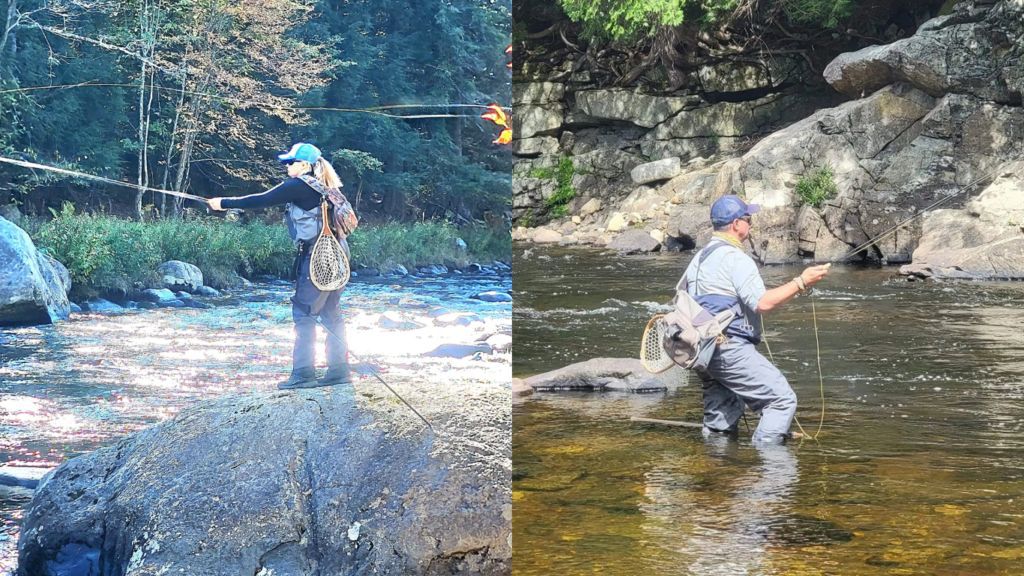 Two people fly fishing in a river. One person casts from a rock, the other wades in water.