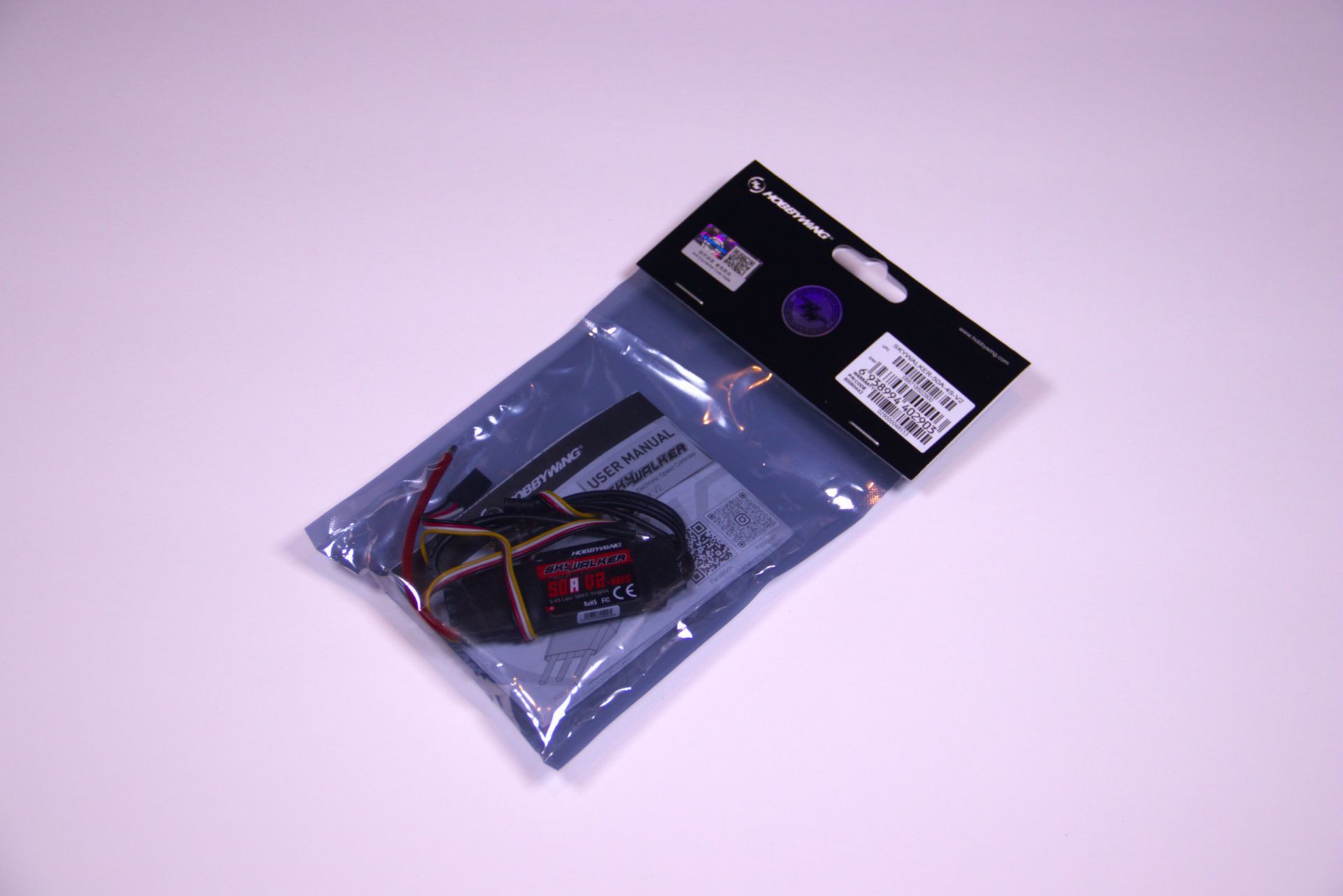 Packaged electronic cable kit in a clear plastic bag with a black header card.