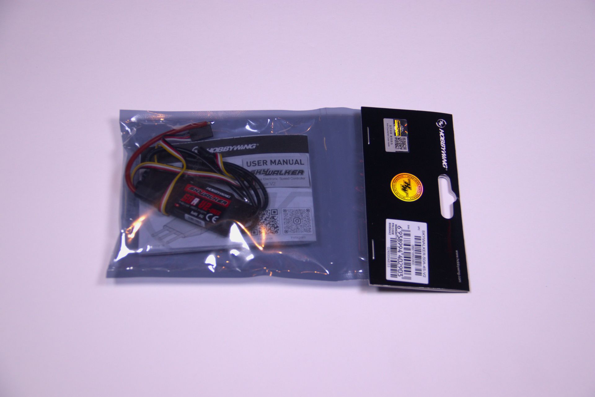 Packaged electronic cable kit in a clear plastic bag with a black header card.