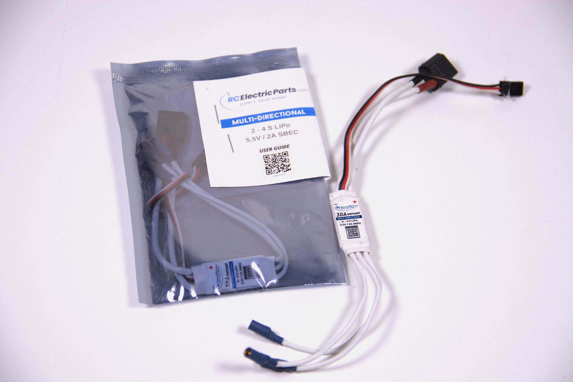 Electronics cable assembly in a silver anti-static bag with white wires and connectors attached