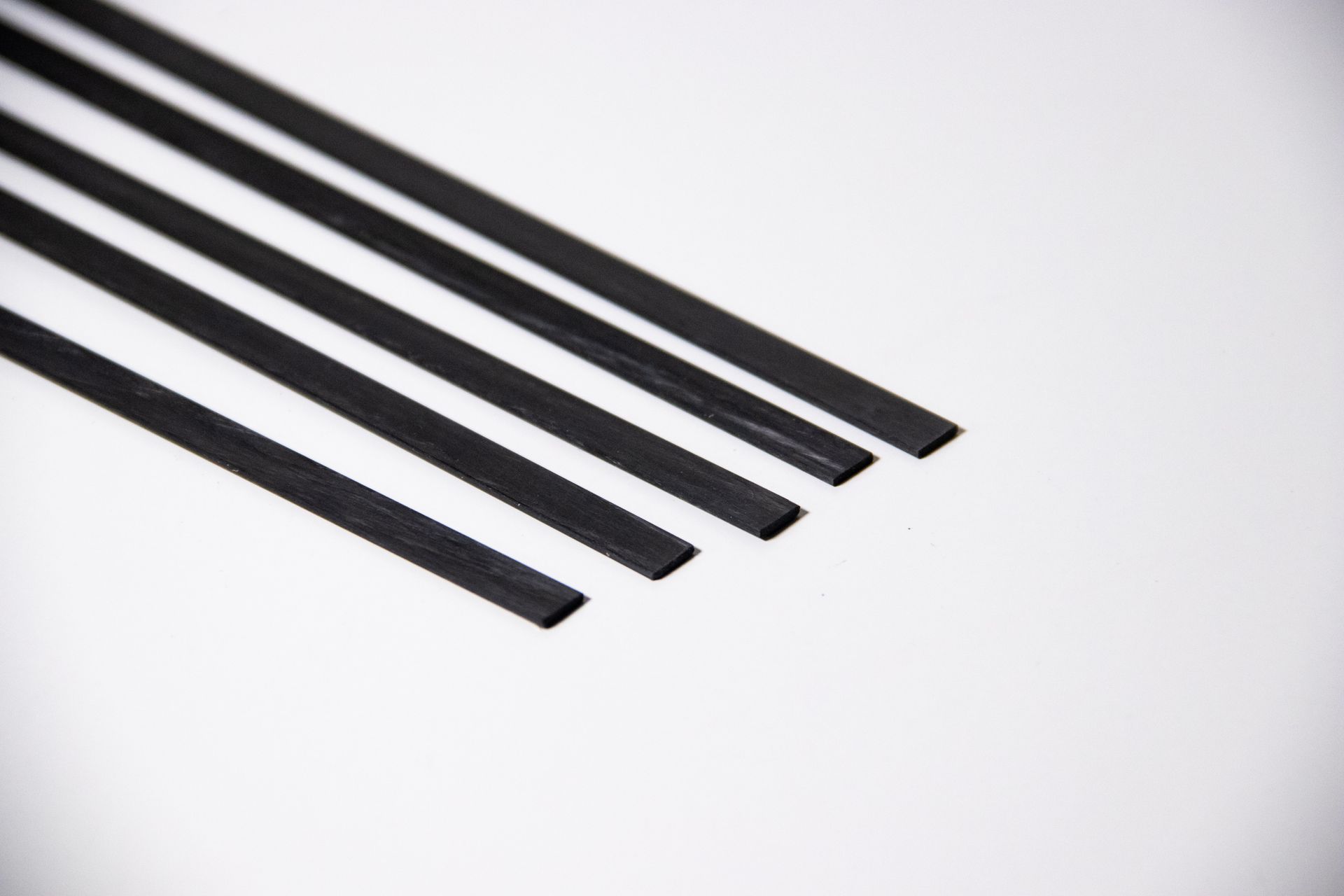 Four black diagonal strips on a white background
