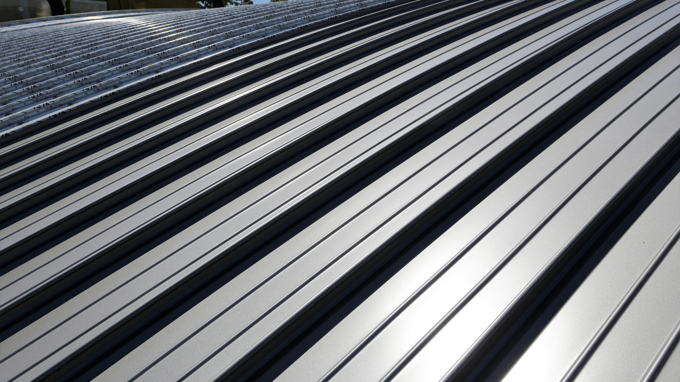Metal roof with alternating silver and black ridges, angled perspective.