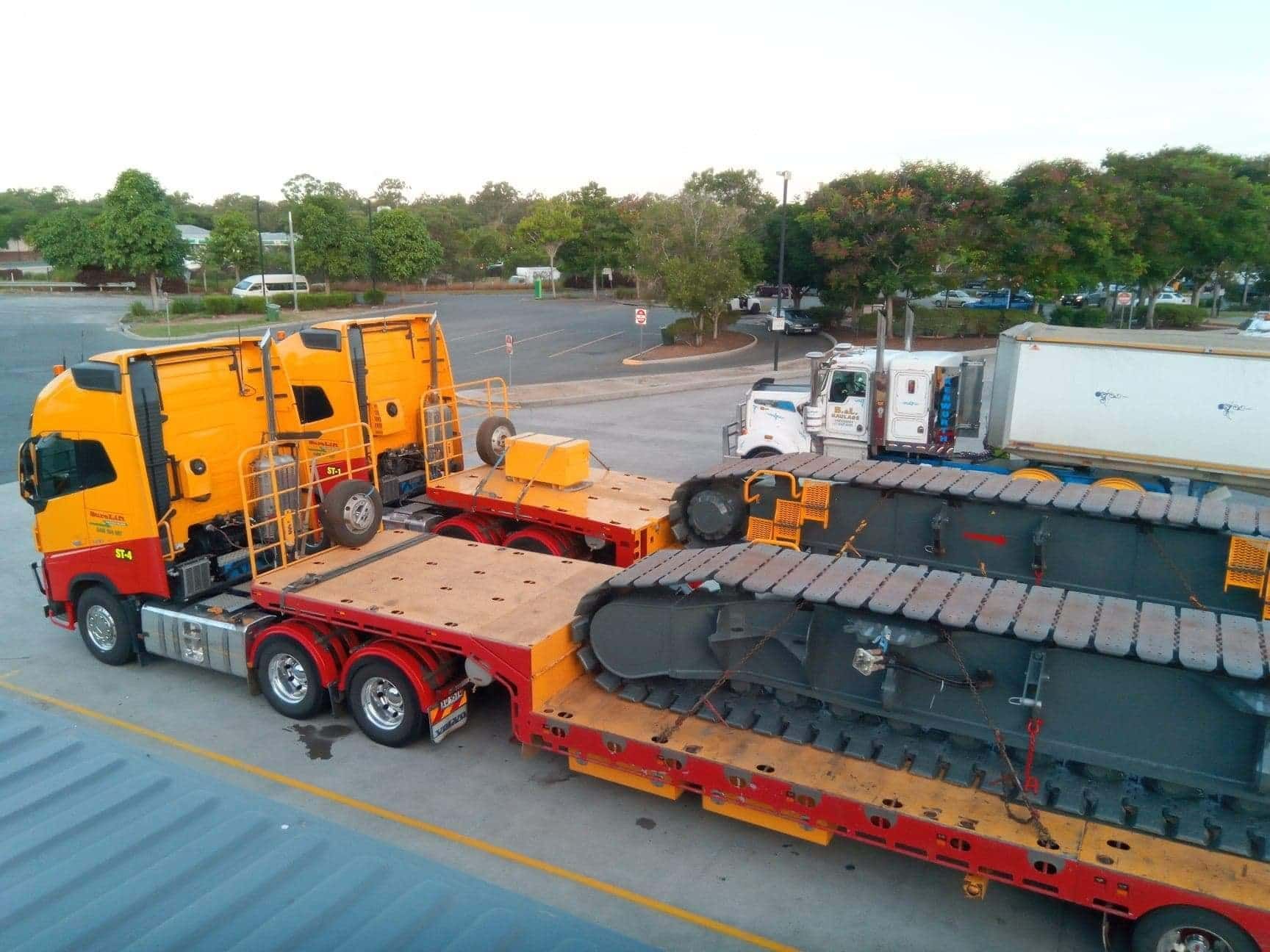 A Truck Is Carrying A Large Piece Of Equipment On A Trailer — SureLift Crane Hire In Bowen, QLD