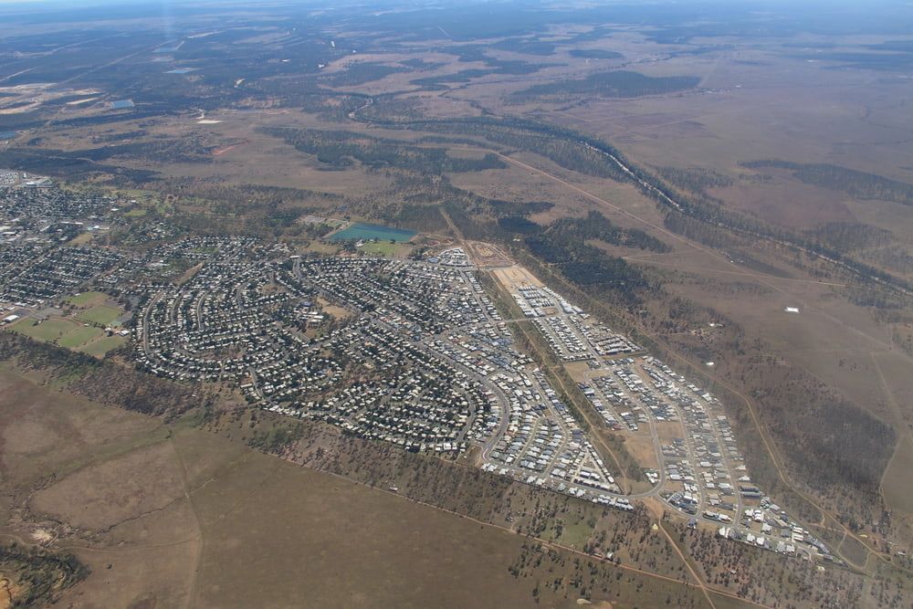 An Aerial View Of A City In The Middle Of A Desert — SureLift Crane Hire In Moranbah, QLD