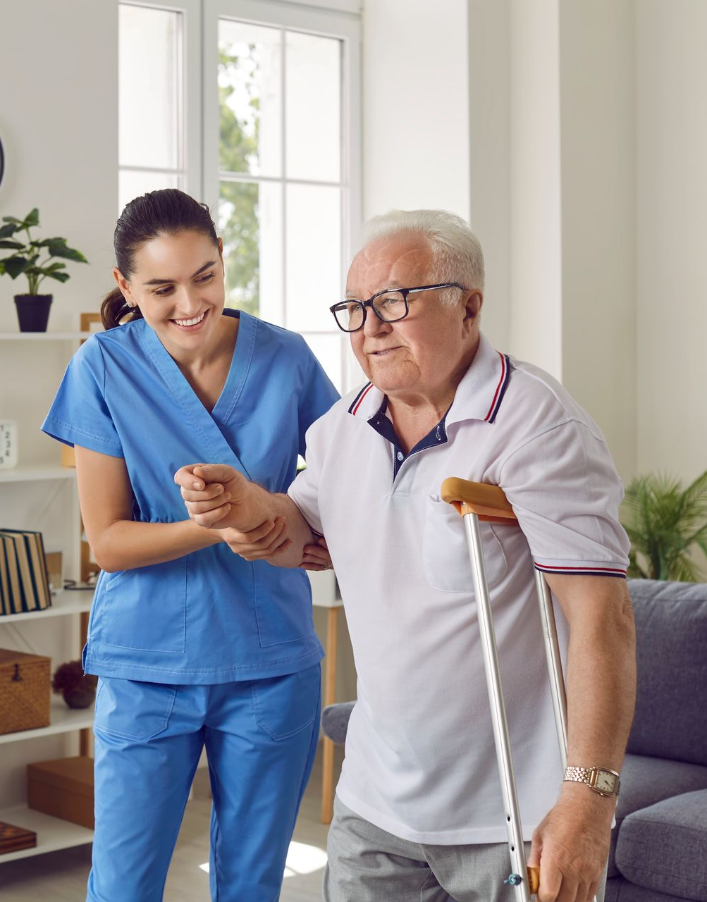 A caregiver assists an elderly person walking with a cane in a bright room A caregiver assists an elderly person walking with a cane in a bright room