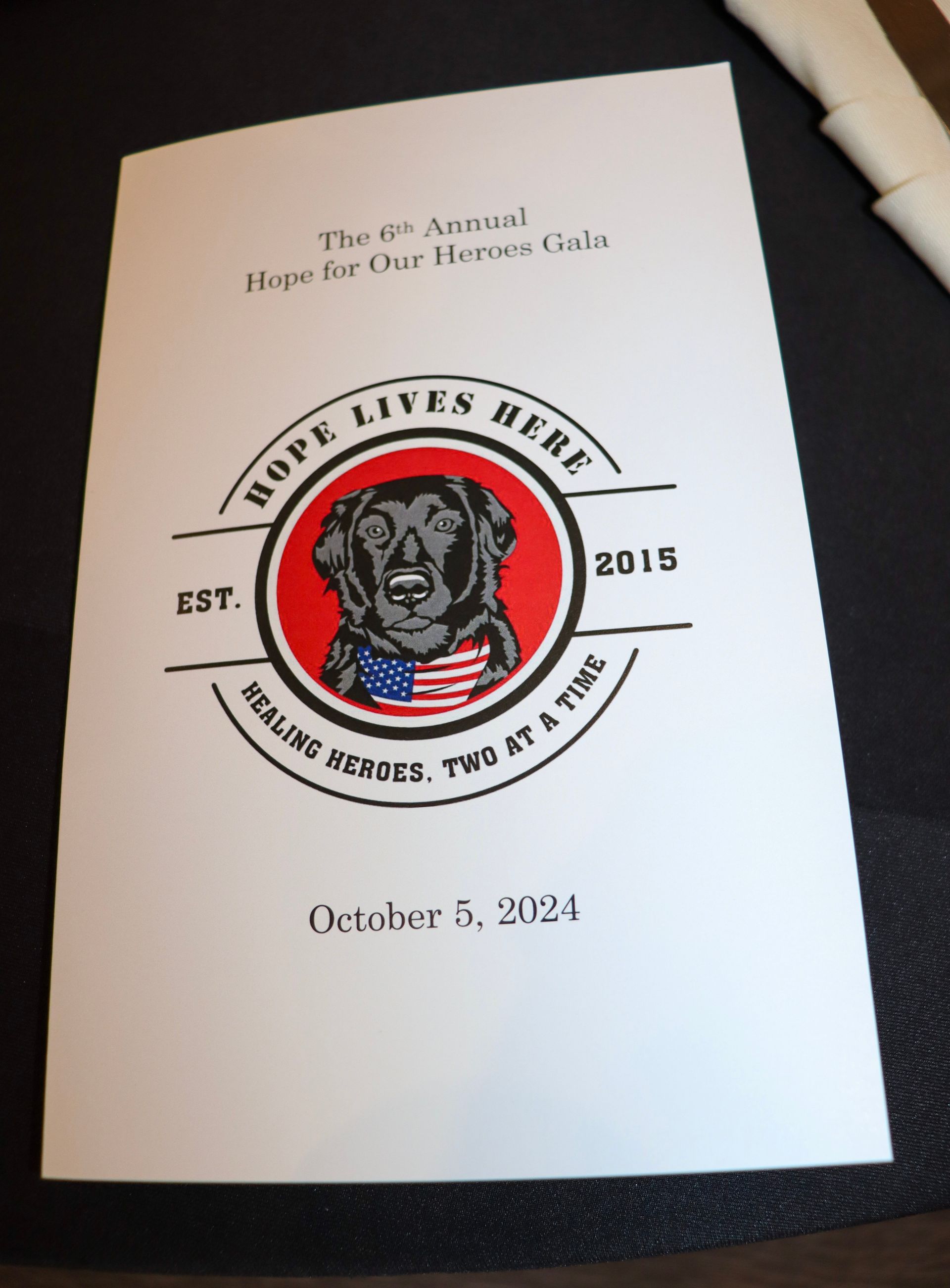 A program for the 6th Annual Hope For Our Heroes Gala on October 6, 2021, featuring a logo of a dog wearing a flag bandana.
