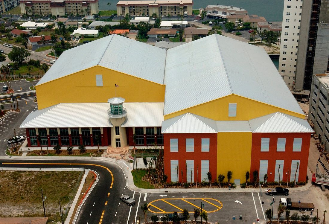 An aerial view of a large yellow and red building