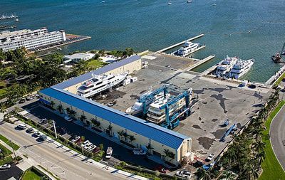 An aerial view of a marina with boats docked in it