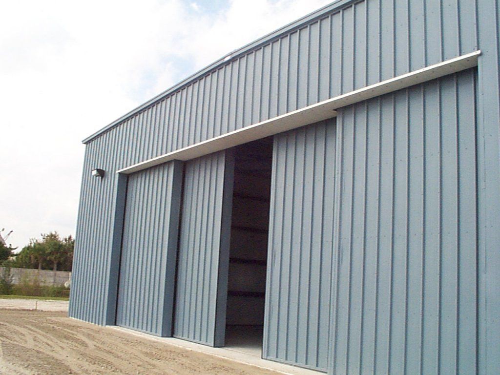 A building with sliding doors on the side of it