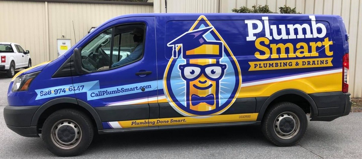 A plumbsmart van is parked in a parking lot.