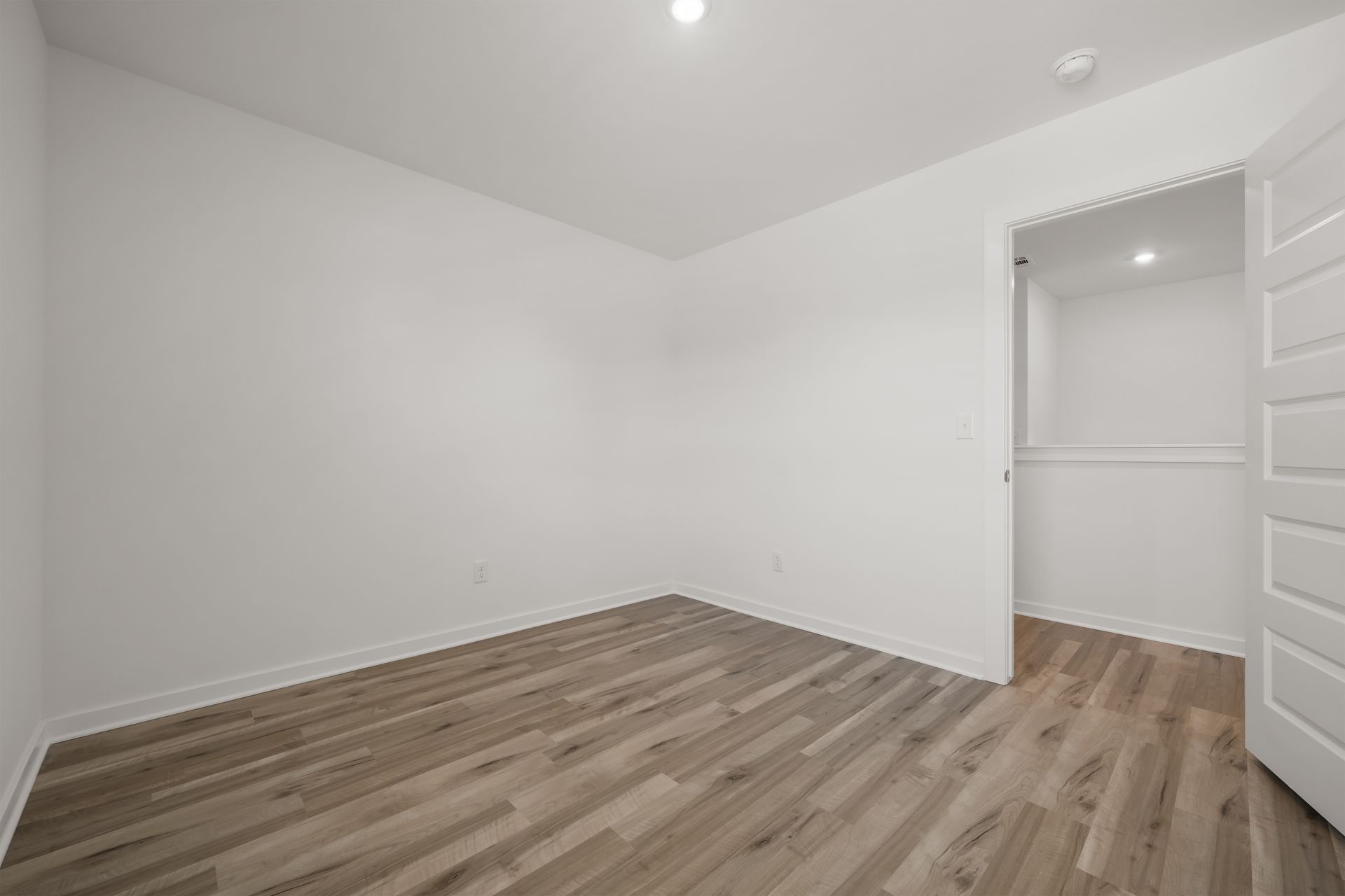 Upstairs secondary bedroom with closet