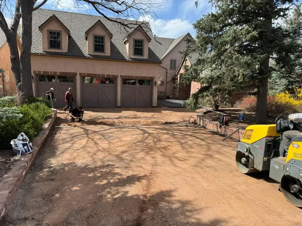 A large house with a lot of dirt in front of it.