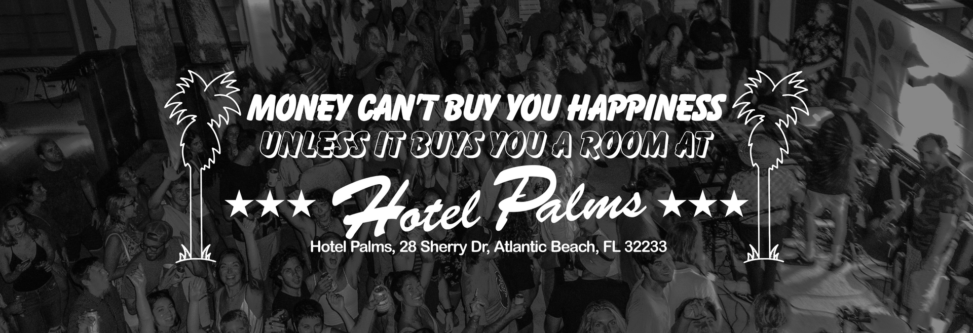 Black-and-white hotel sign with the quote “Money can’t buy you happiness” and “Hotel Palmas.”