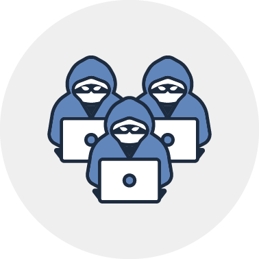 A group of people in hoodies are sitting in front of laptops.