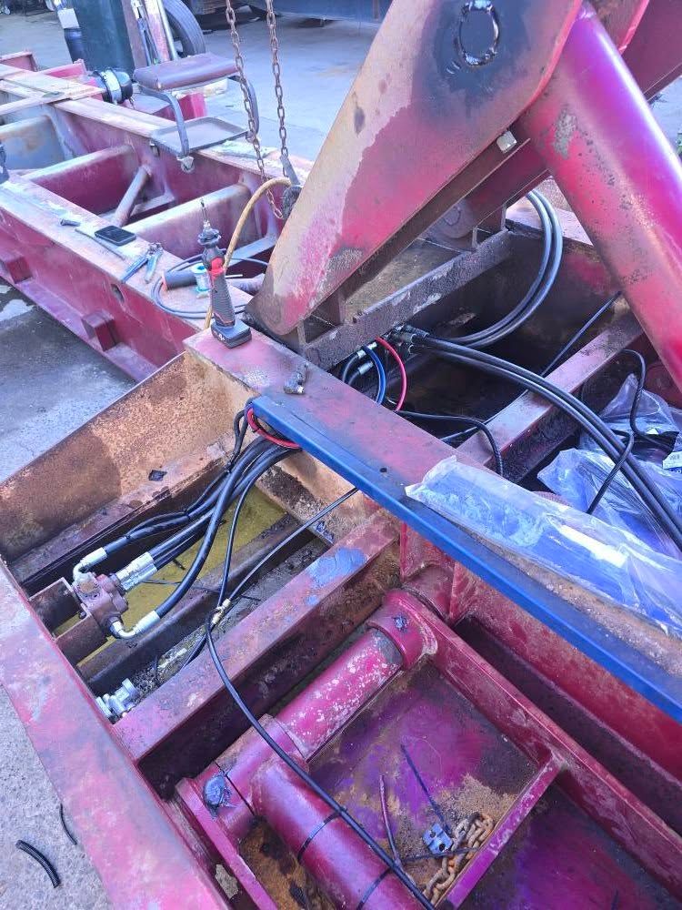 A Red Industrial Trailer Frame with Hydraulic Hoses and Metal Components — Banana Coast Heavy Diesel in Grafton, NSW