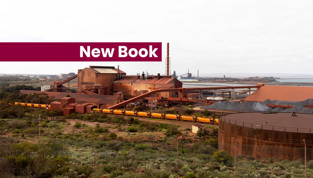 Landscape image with coal train, coal storage and shipping port in distance. Text reads