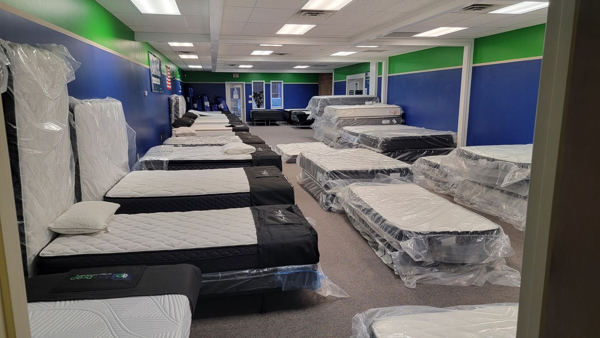 BoxDrop Syracuse mattress store Syracuse NY showroom displaying affordable mattresses and quality sleep products for customers