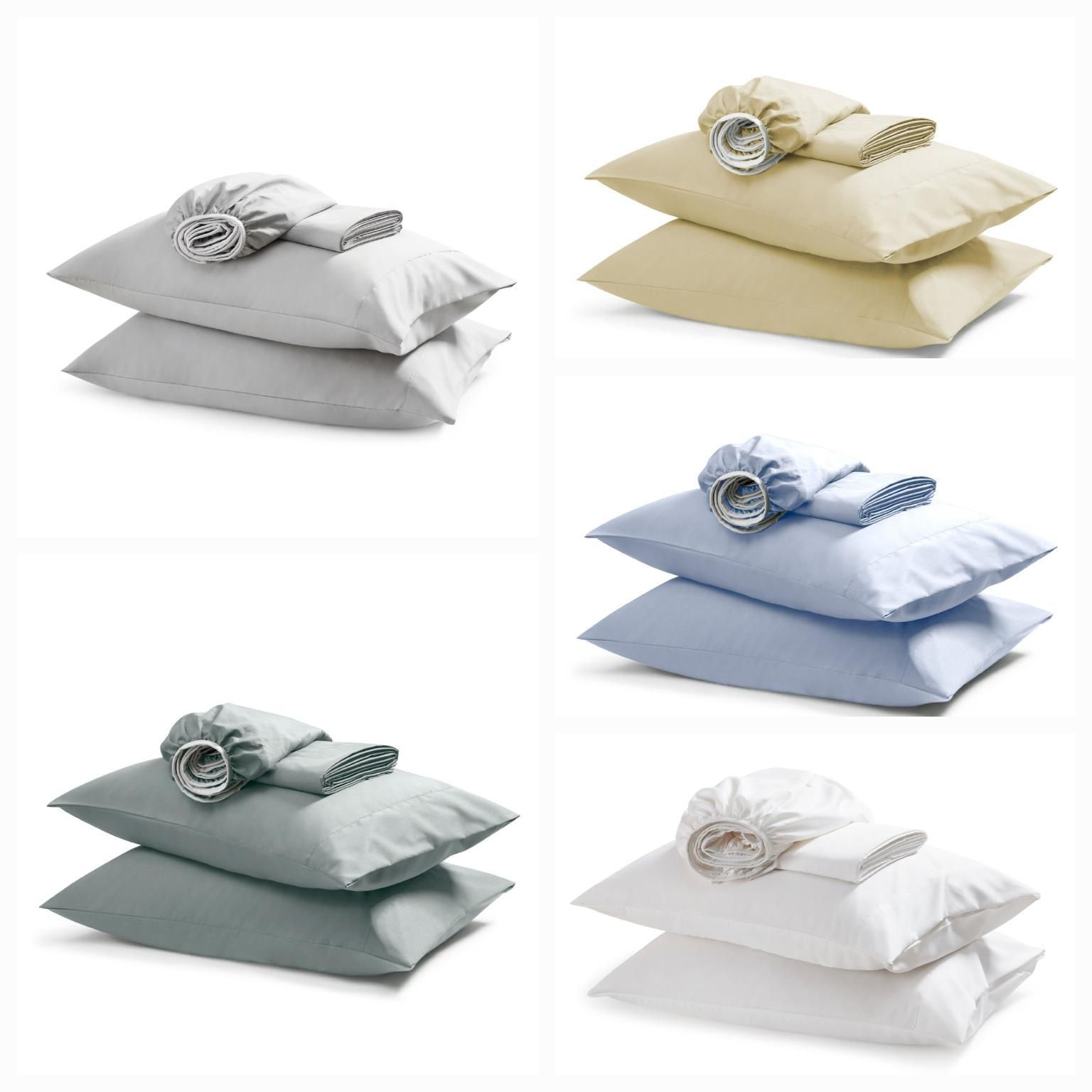 Six sets of bed pillows in various solid colors, with coordinating accessories.
