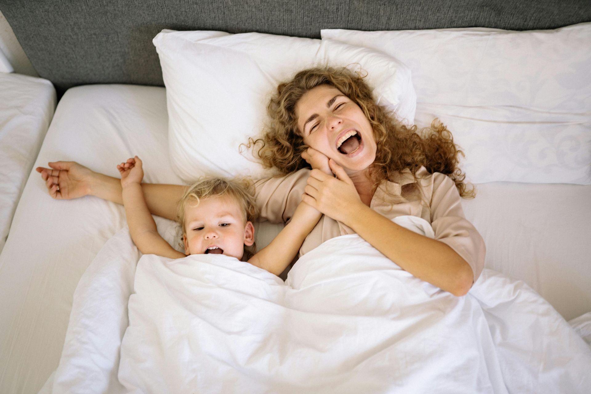 BoxDrop Syracuse family enjoying cozy sleep at mattress store Syracuse NY with soft comfortable bedding and relaxation