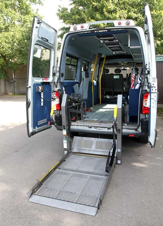 A Van With a Handicap Ramp is Parked on the Side of the Road — Truck Training and Assessments In Umina Beach, NSW
