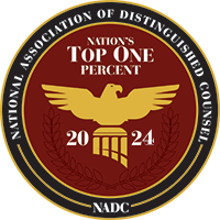 National Association of Distinguished Counsel “Nation’s Top One Percent” emblem with gold eagle and red background, 2024