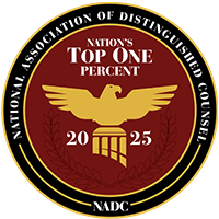 Circular gold-and-black NADC logo with eagle, “Nation’s Top One Percent,” and 2025 text