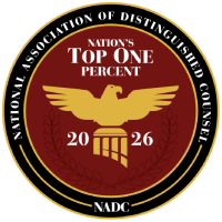 National Association of Distinguished Counsel Top One Percent 2026 emblem with gold eagle on maroon seal