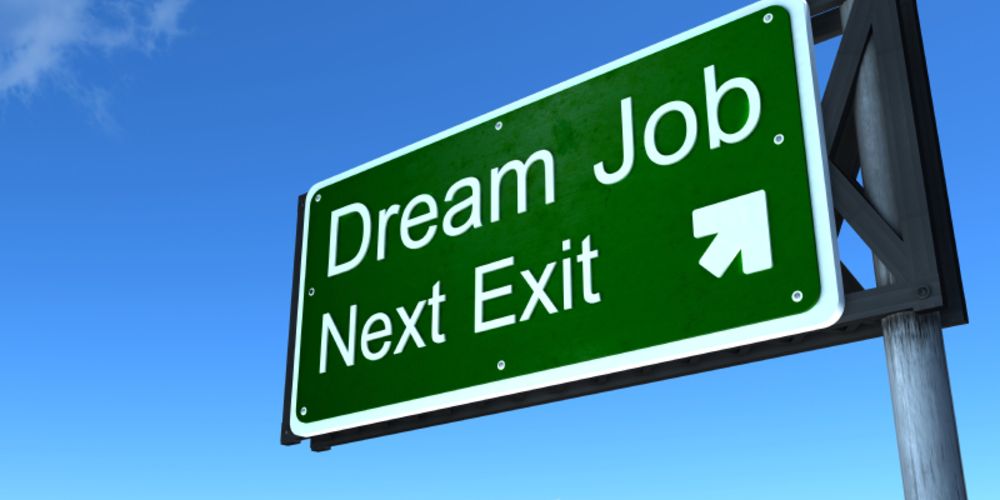 A green sign that says dream job next exit