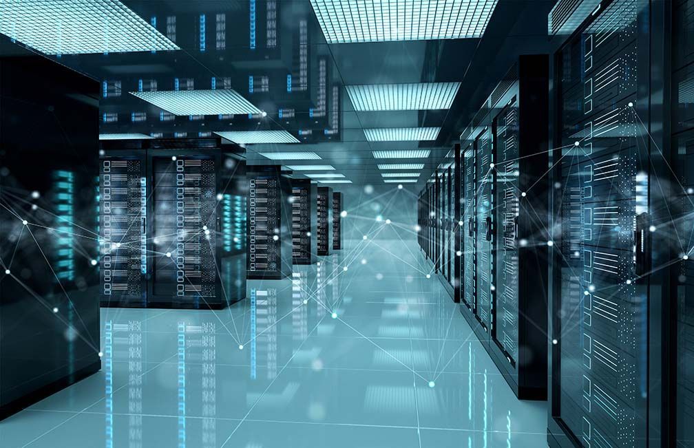 Data center with rows of servers lit with blue lights.