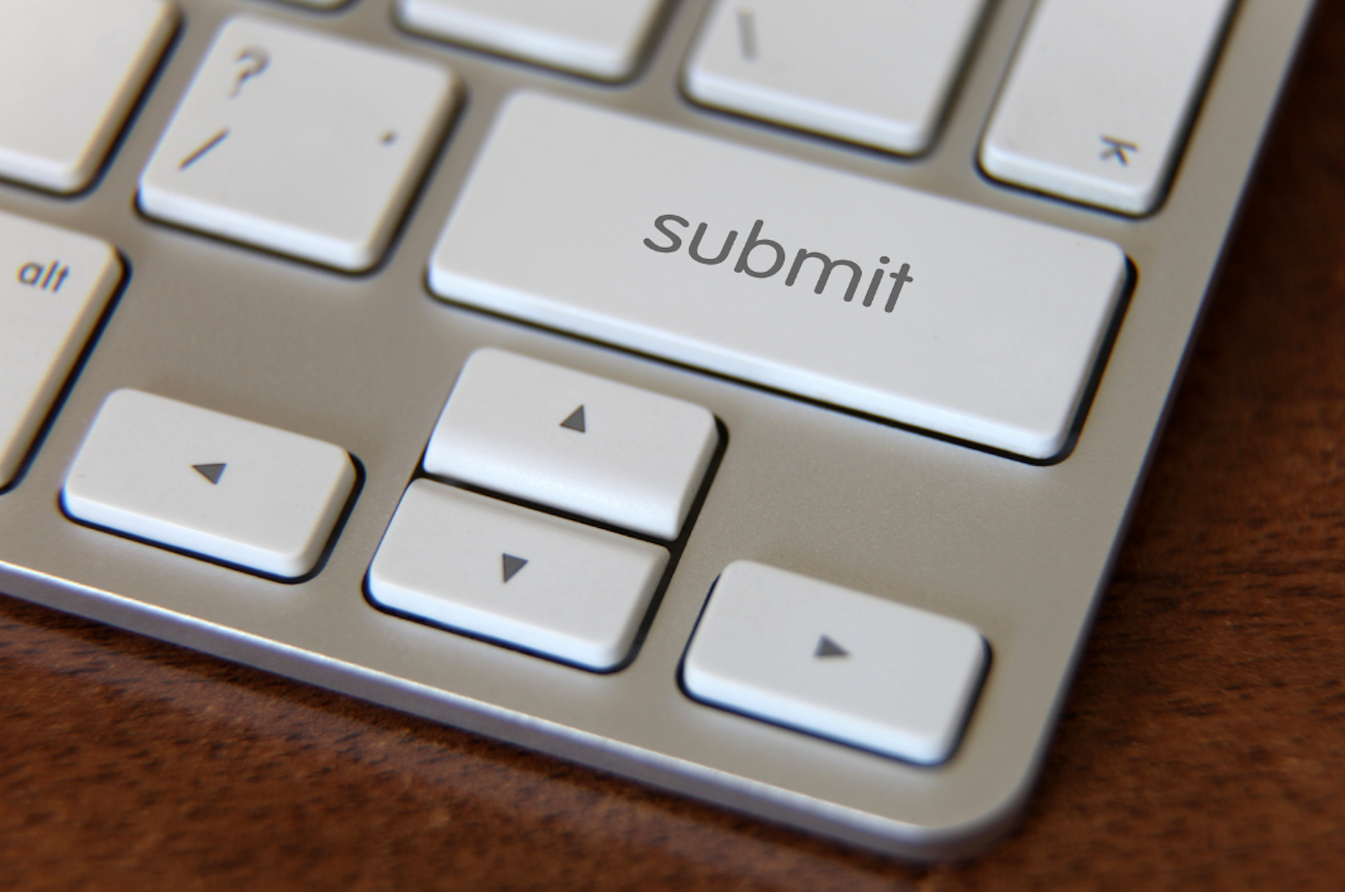 A close up of a keyboard with a submit button
