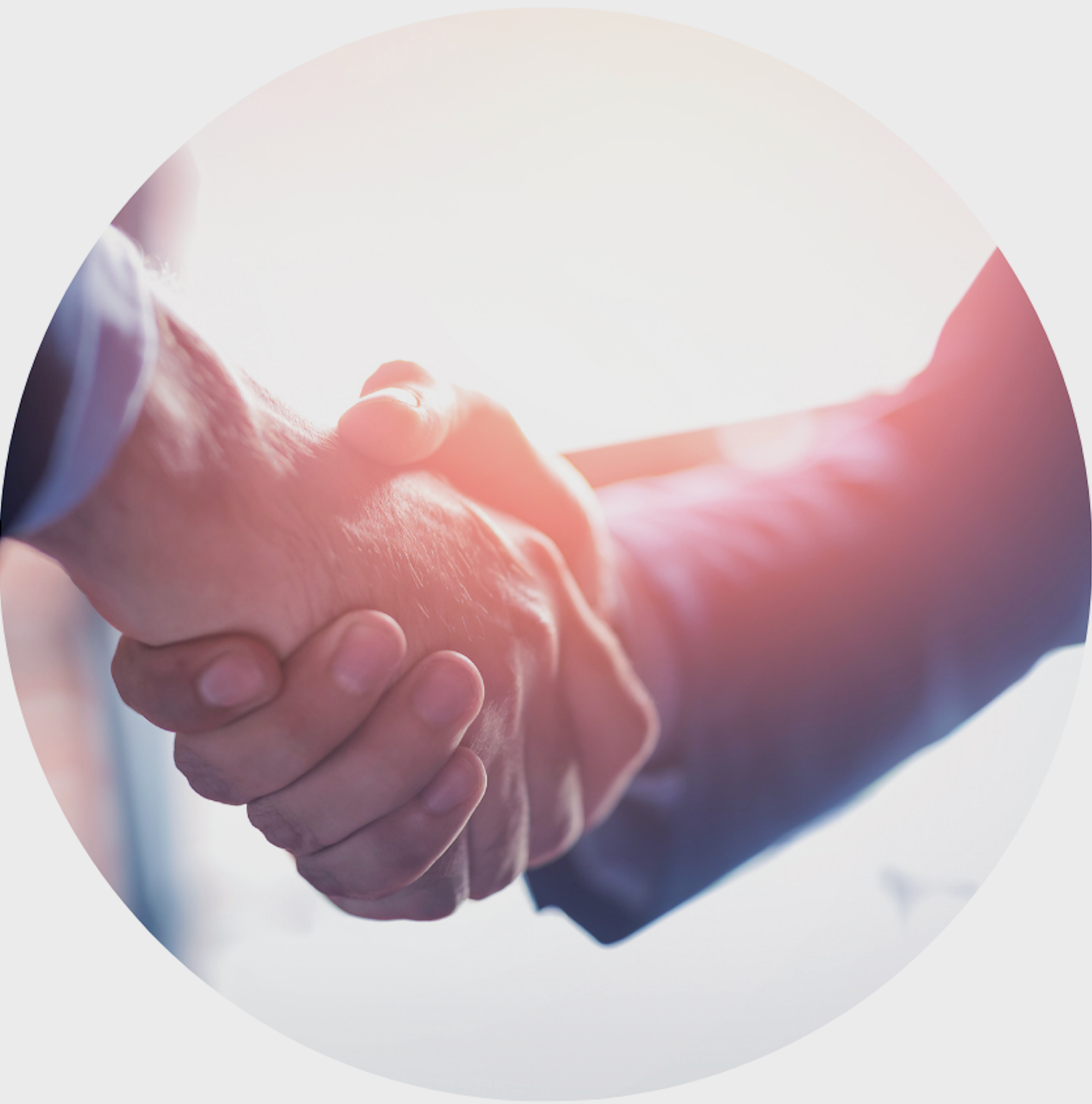 A close up of two people shaking hands in a circle