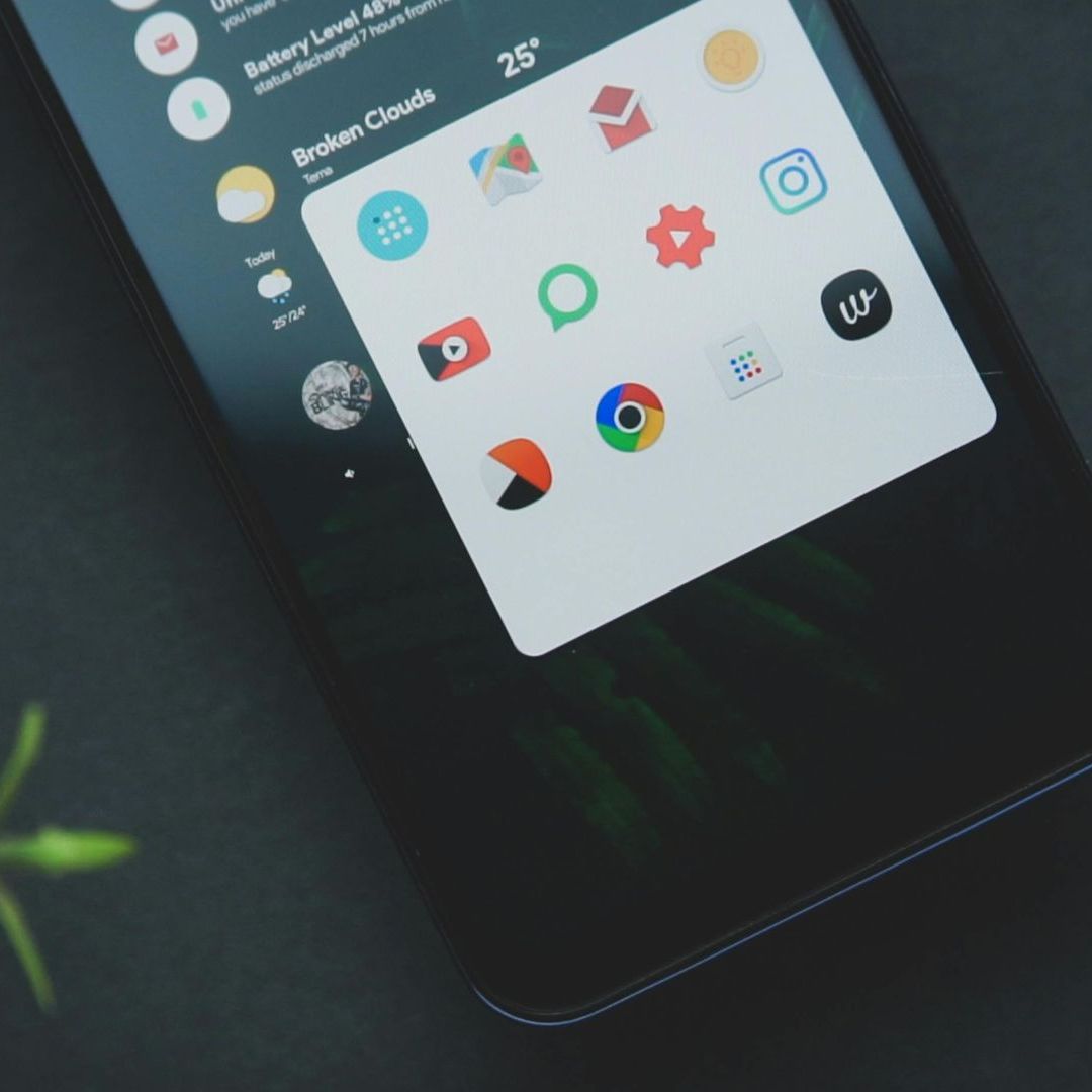 A cell phone with a broken clock app on it