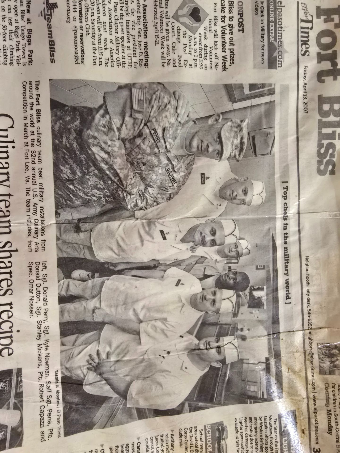 Newspaper front page with a photo of soldiers standing beside a tank under the headline “Fort Bliss”