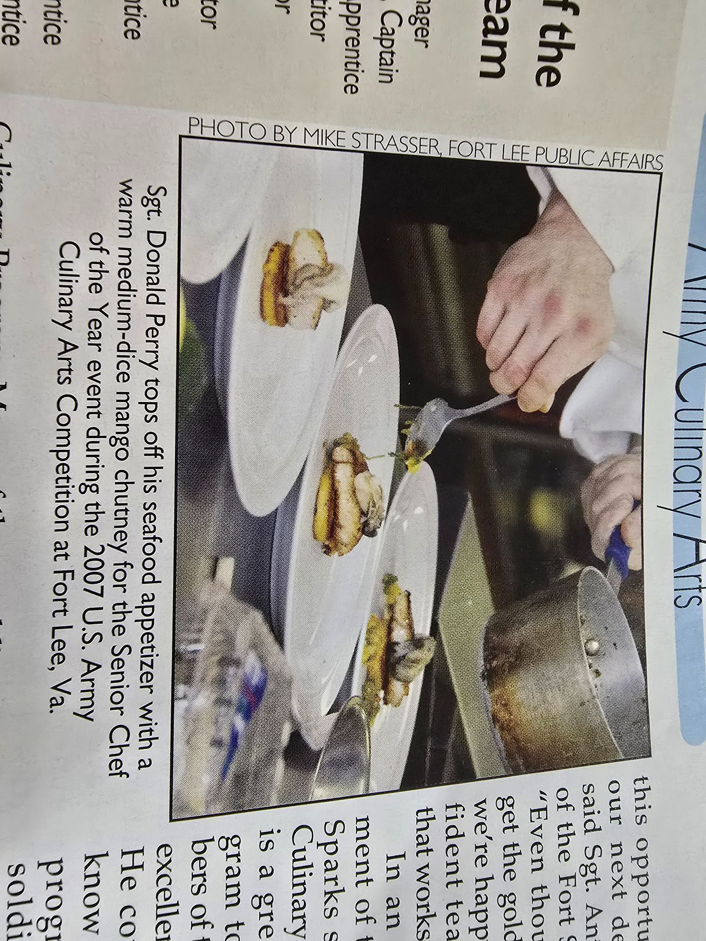 Hands serving food onto plates at a cafeteria or buffet counter