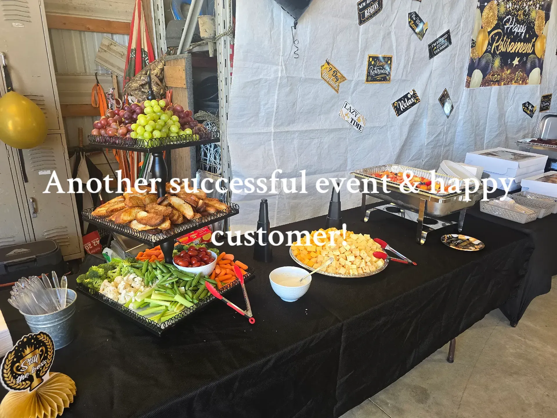 Buffet table with salads, fruit, and dishes at an event, with text reading “Another successful event & happy customers.”
