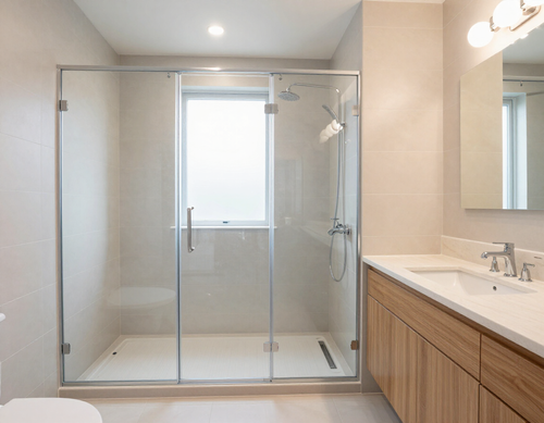 Remodeled bathroom with tiled shower