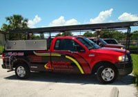 Red pick up truck — Leesburg, FL — Aluminum Contractors Inc