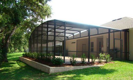 Enclosure with small plants beside it — Leesburg, FL — Aluminum Contractors Inc