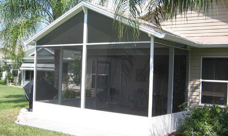 Nice beige house with small white screen room — Leesburg, FL — Aluminum Contractors Inc