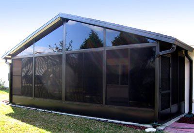 Screen room with dark tinted windows — Leesburg, FL — Aluminum Contractors Inc