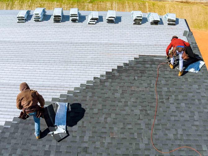 Workers Installing New Roof — Hubertus, WI — Northwest Roofing, Inc. Workers Installing New Roof — Hubertus, WI — Northwest Roofing, Inc.