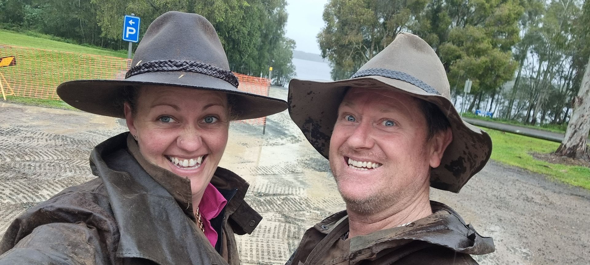 Mel & Chad, Happy with a job well done after a wet day