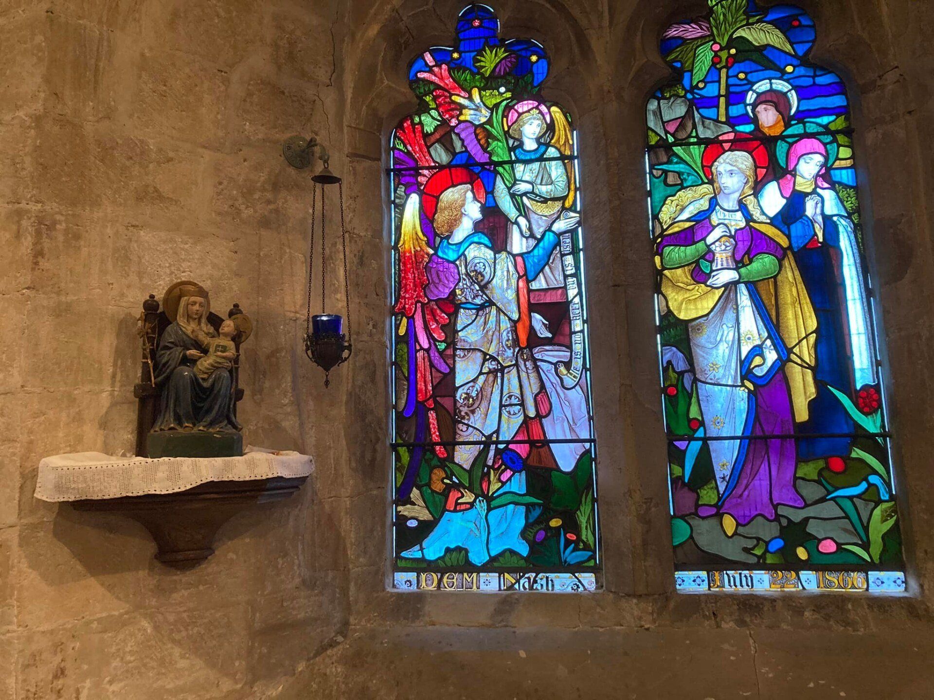 Stained glass window and statue of Our Lady of Walsingham (inside St James the Less)