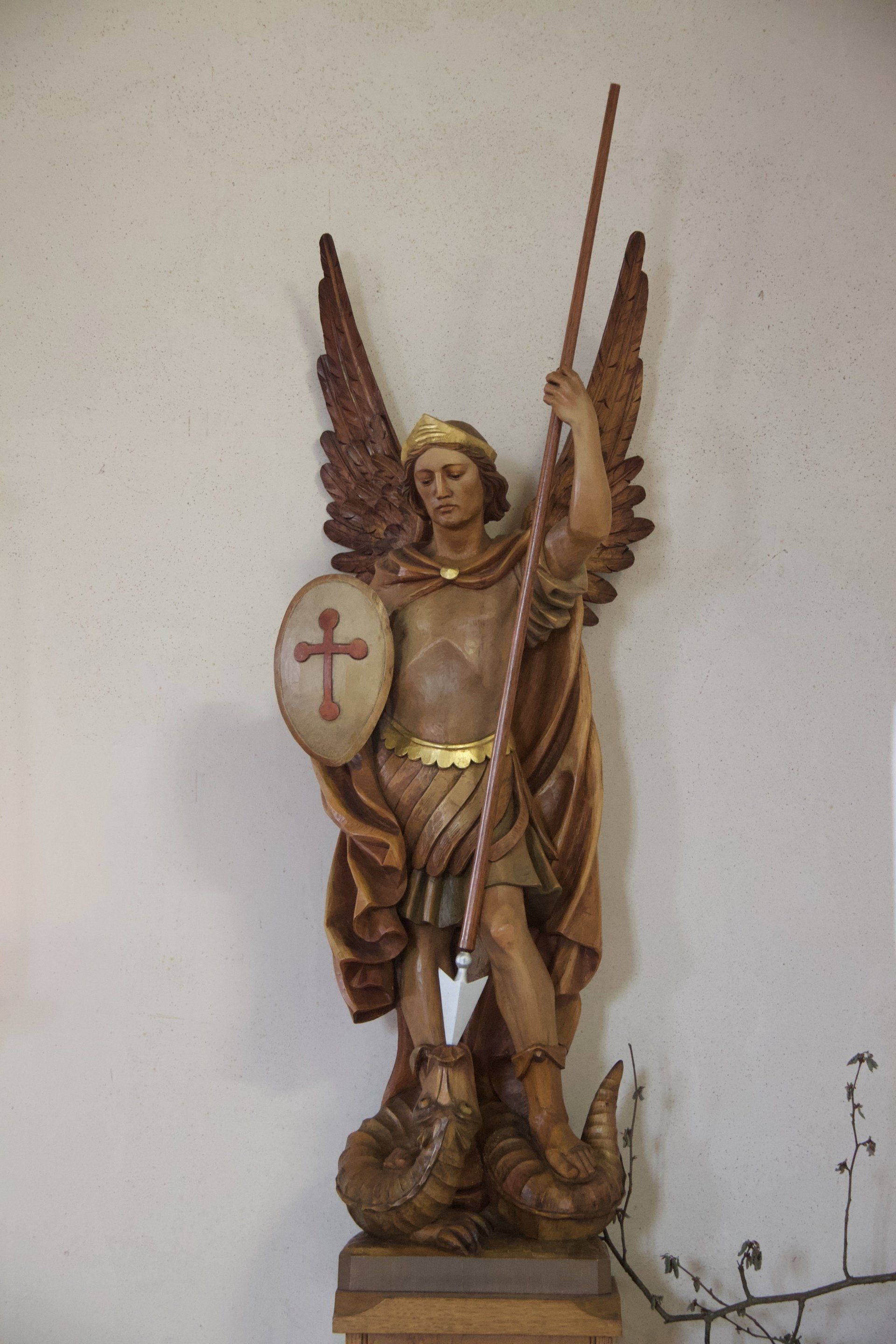 Statue of St Michael slaying the dragon (inside St Michael's Church)