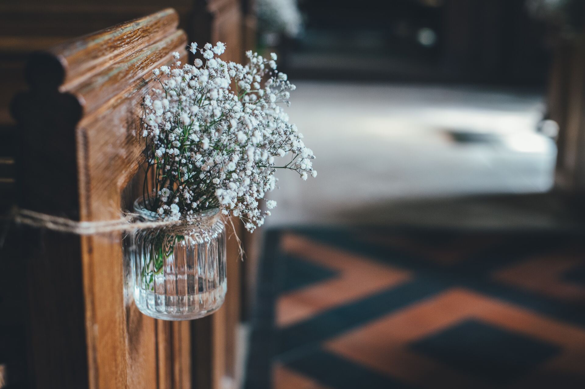 Flowers attached to end of box pew