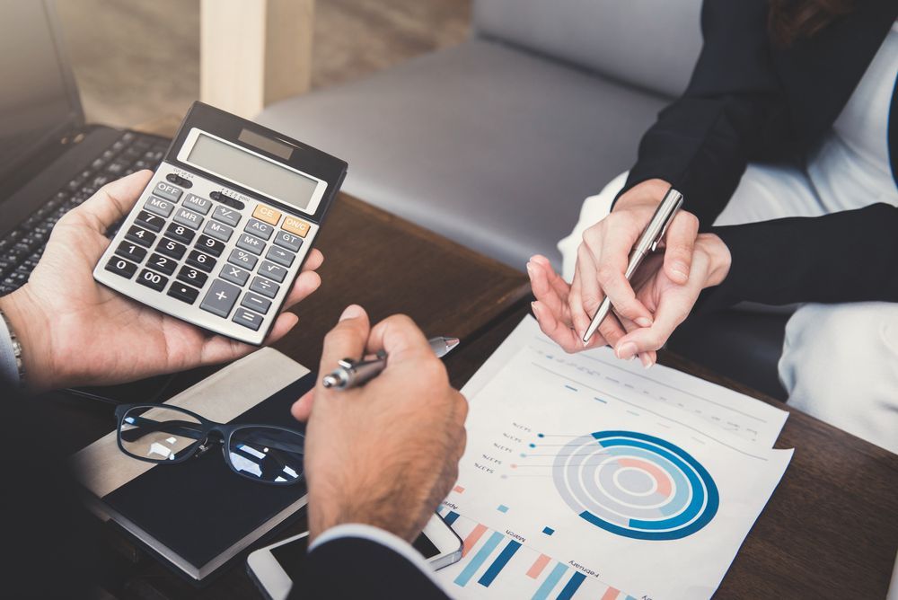 Two People Reviewing Financial Documents — Blue Chip Bookkeeping in Cairns, QLD