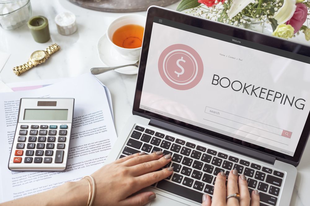 Business Woman Using Calculator For Do Math Finance — Blue Chip Bookkeeping In Nome, QLD