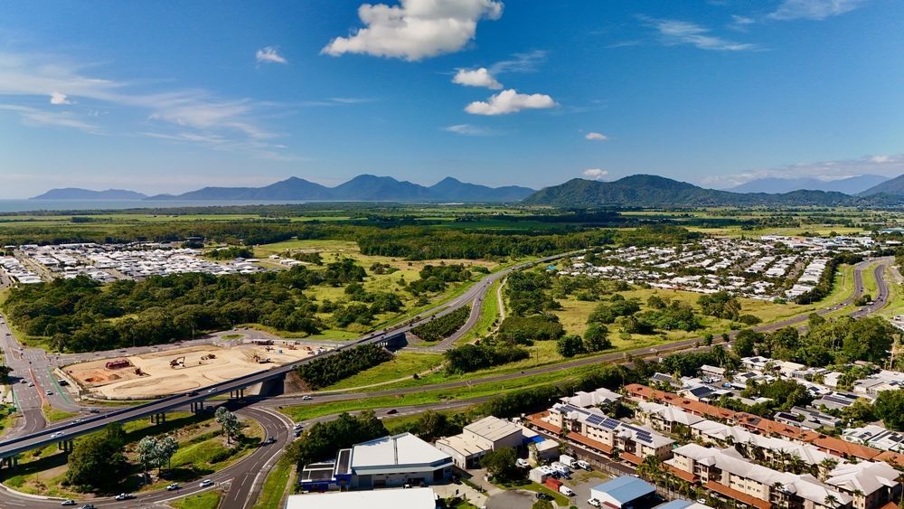 Aerial View of Town With Road, Buildings, Trees, and Mountains — Blue Chip Bookkeeping In Cairns, QLD 