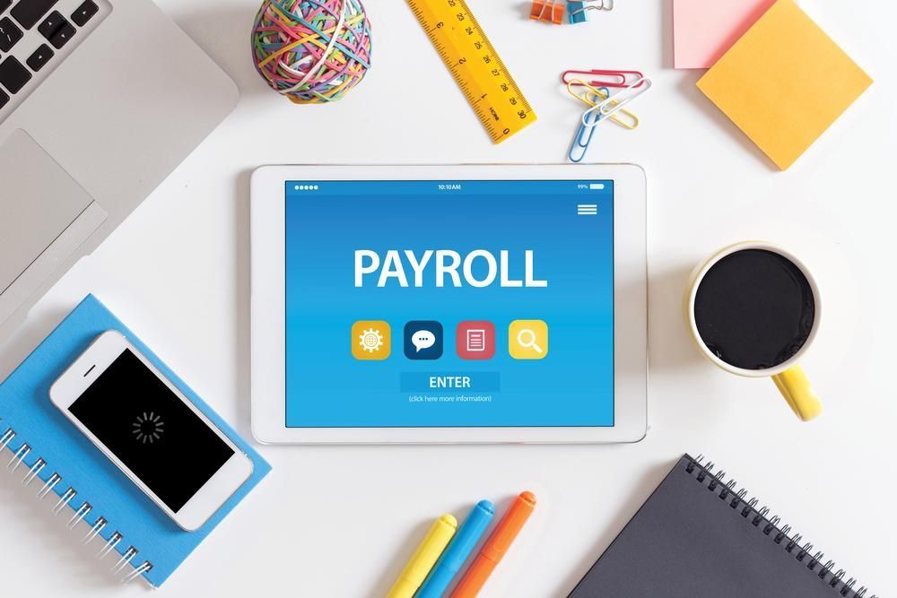 Ipad Placed On Table Showing Payroll On Screen — Blue Chip Bookkeeping In Townsville, QLD